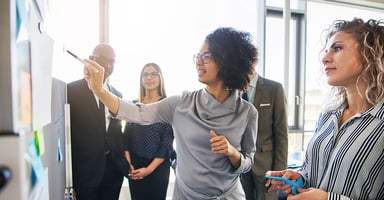 Team focused on a whiteboard