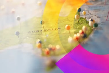 Pins located on Australia on a globe. 