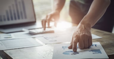 Finger pointing to pie graph