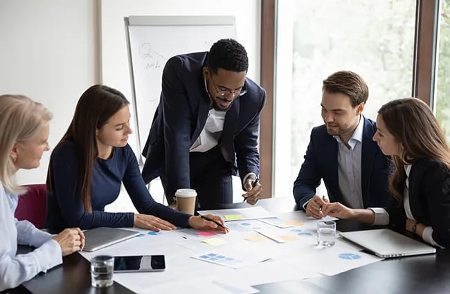 Group of business professionals working together at a conference table