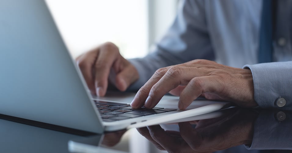 Hands on laptop typing