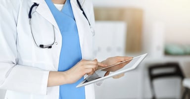 healthcare-professional-on-tablet