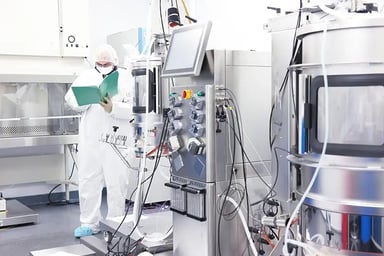 Inspector writing down notes at a clean facility.