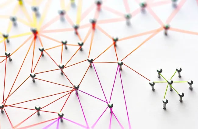 Pins holding up multi colored string