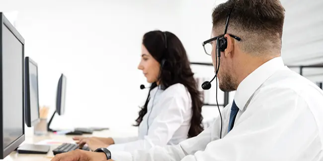 customer-service-professional-wearing-headset-asking-coworker-a-question-ss-2149603273