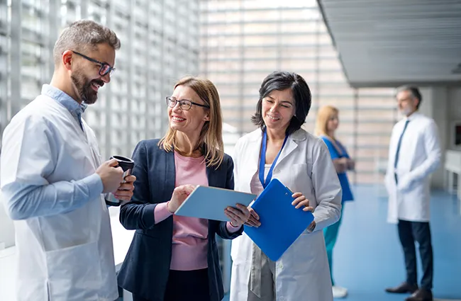 Group of medical professionals smiling in a common area